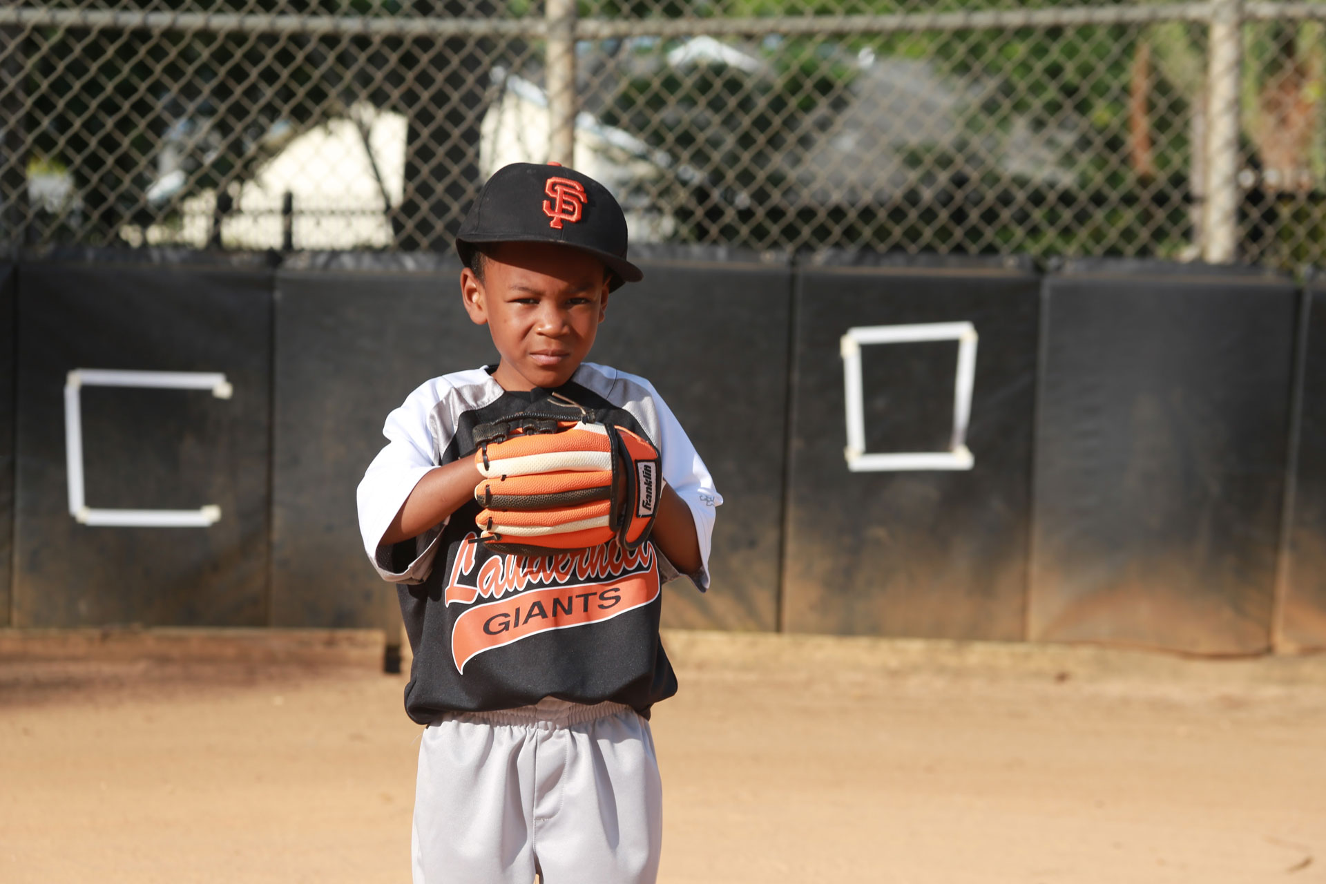 Young Boy on Baseball Field
